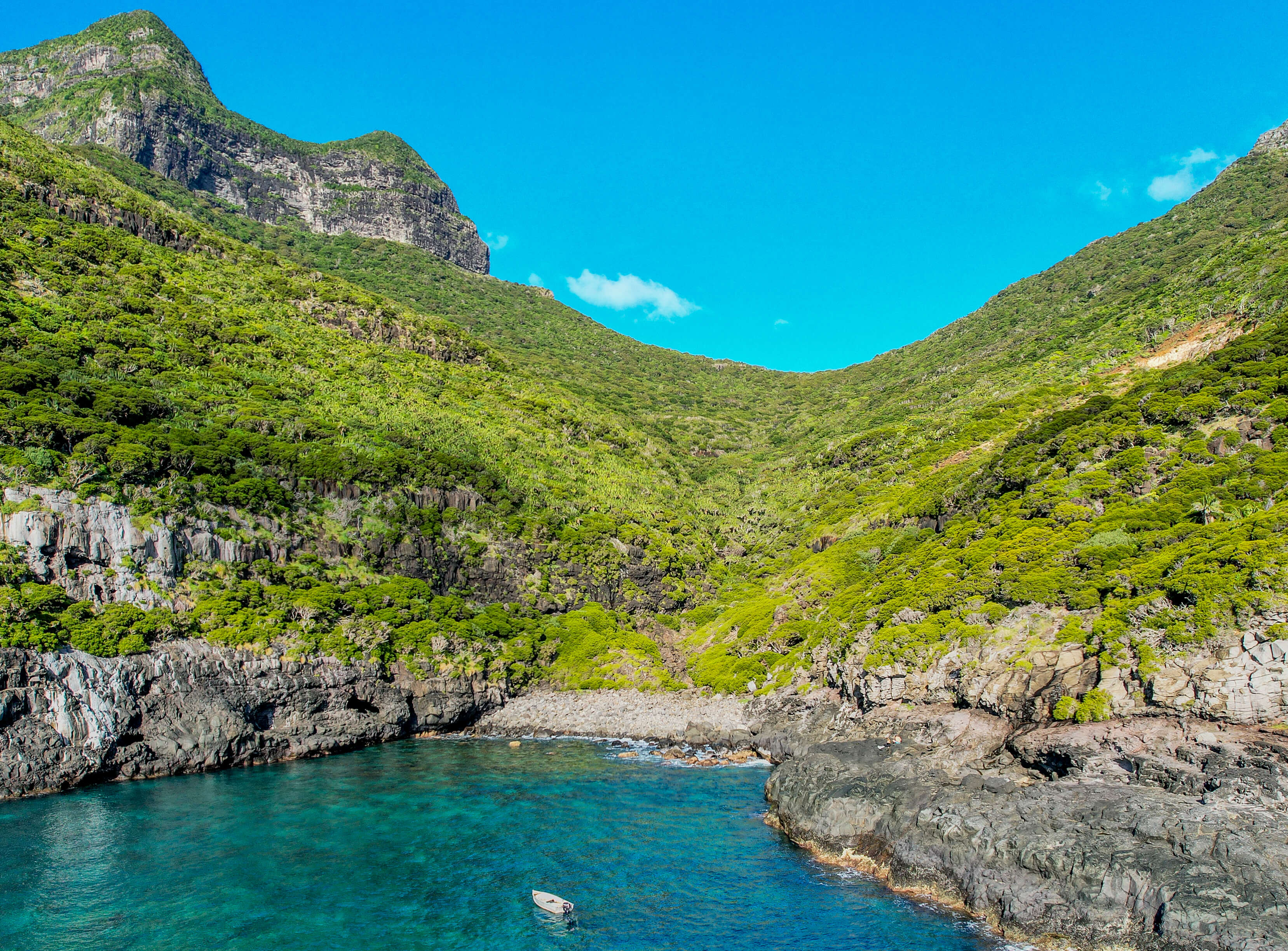 Ocean opening up to a valley on Lord Howe Island