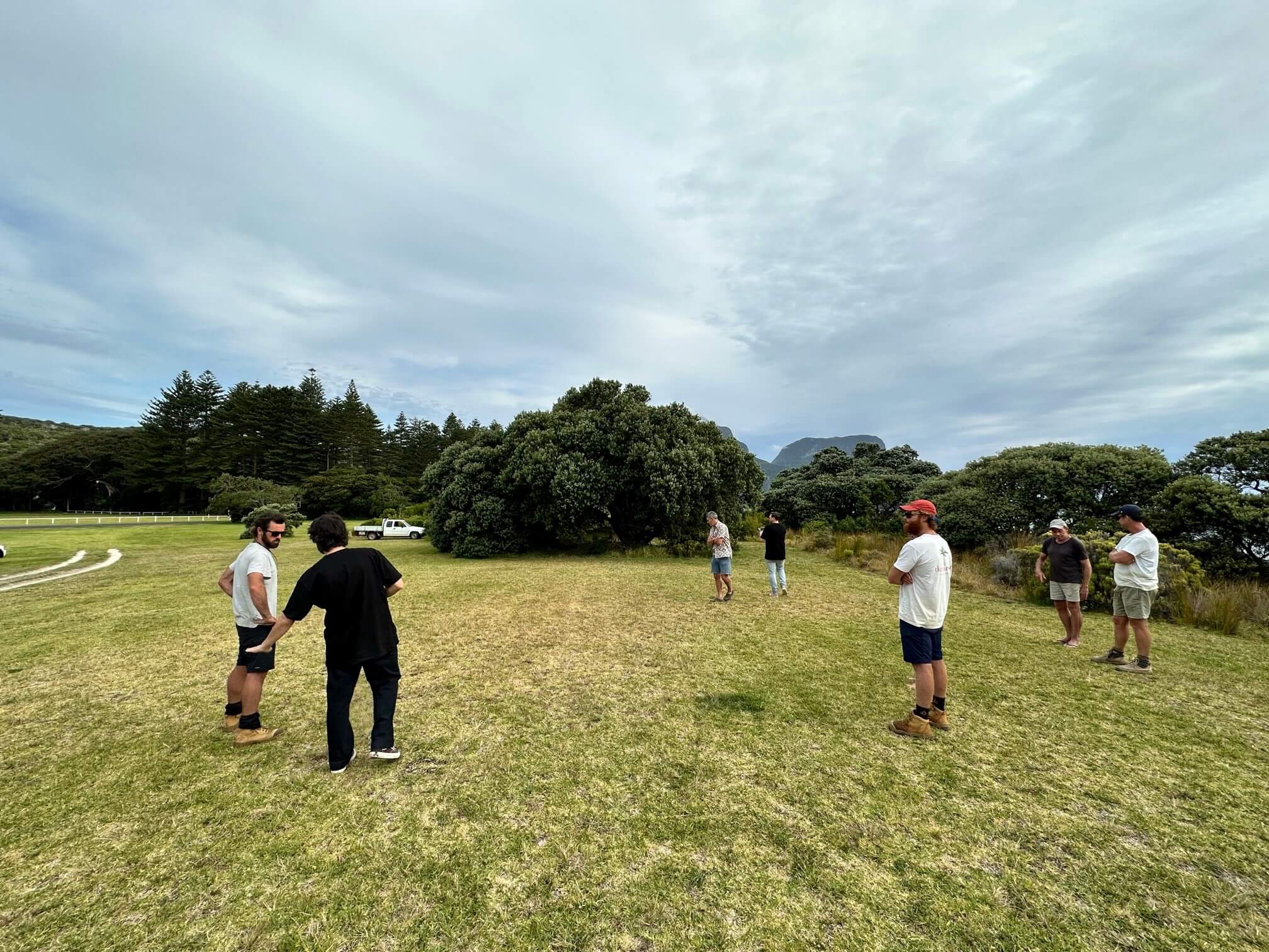 People standing on grass for a site inspection