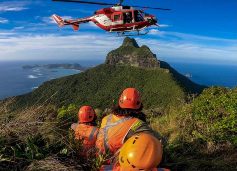 Field teams awaiting a pickup during helicopter winch operations in November 2023.